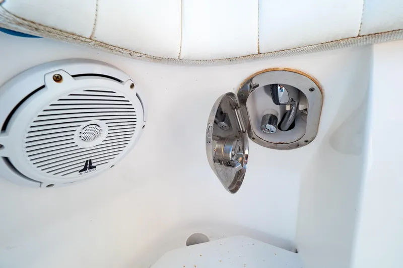 Slide: The Image of 2019 Intrepid 407 Cuddy boat interior with JL Audio speaker and metal fixture. - 72