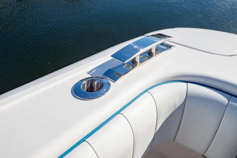 Slide: The Image of 2019 Intrepid 407 Cuddy boat detail with chrome fittings and white upholstery. - 74