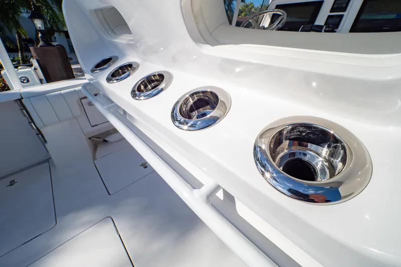 Slide: The Image of 2019 Intrepid 407 Cuddy boat interior with stainless steel cup holders. - 75