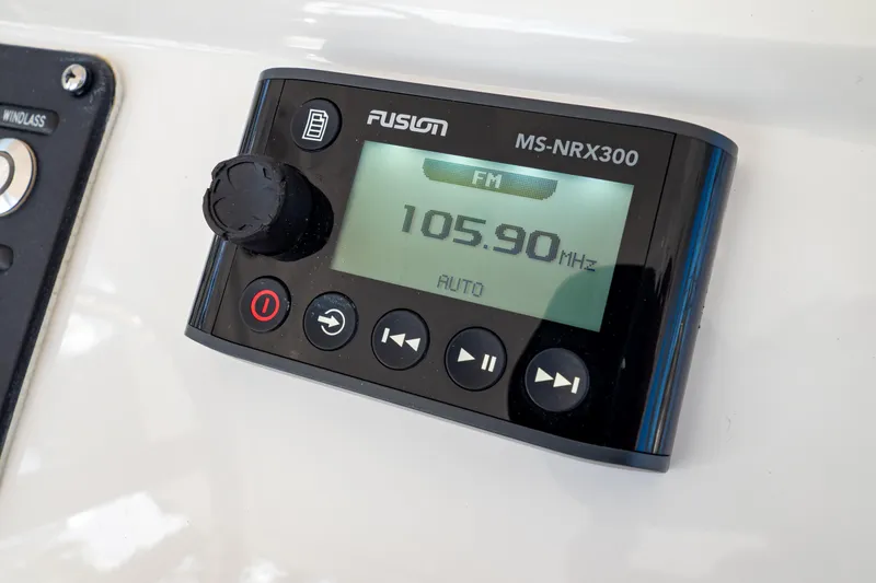 Slide: The Image of Fusion MS-NRX300 radio display on 2019 Intrepid 407 Cuddy, tuned to 105.90 MHz FM. - 81
