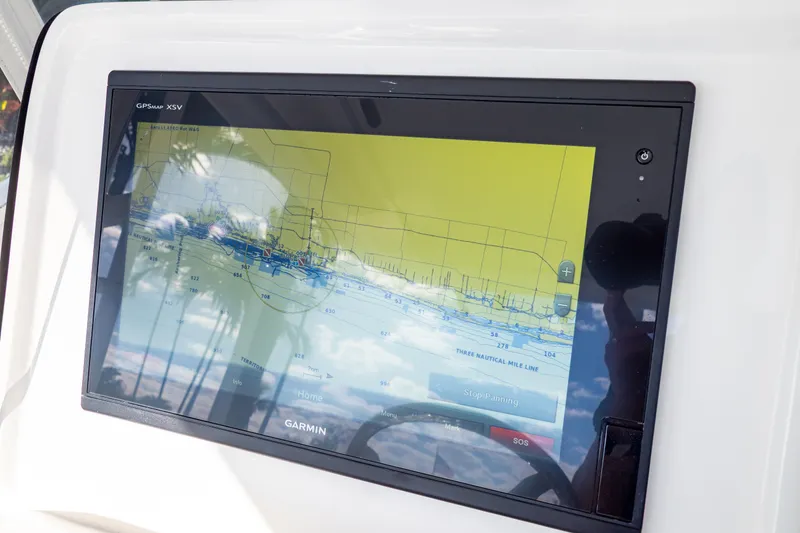 Slide: The Image of Garmin GPS display on 2019 Intrepid 407 Cuddy boat, showing nautical map. - 82