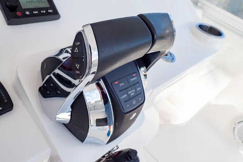 Slide: The Image of Throttle controls on a 2019 Intrepid 407 Cuddy boat dashboard. - 85