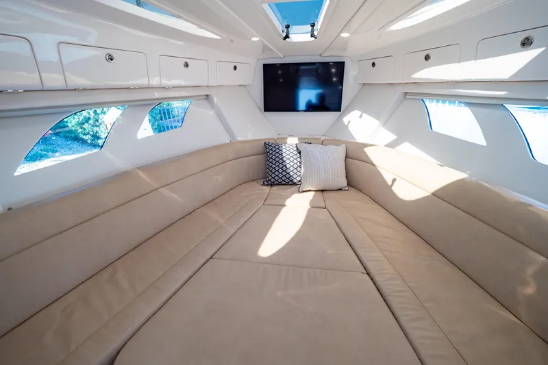 Slide: The Image of Luxurious interior of 2019 Intrepid 407 Cuddy with plush seating and modern amenities. - 9