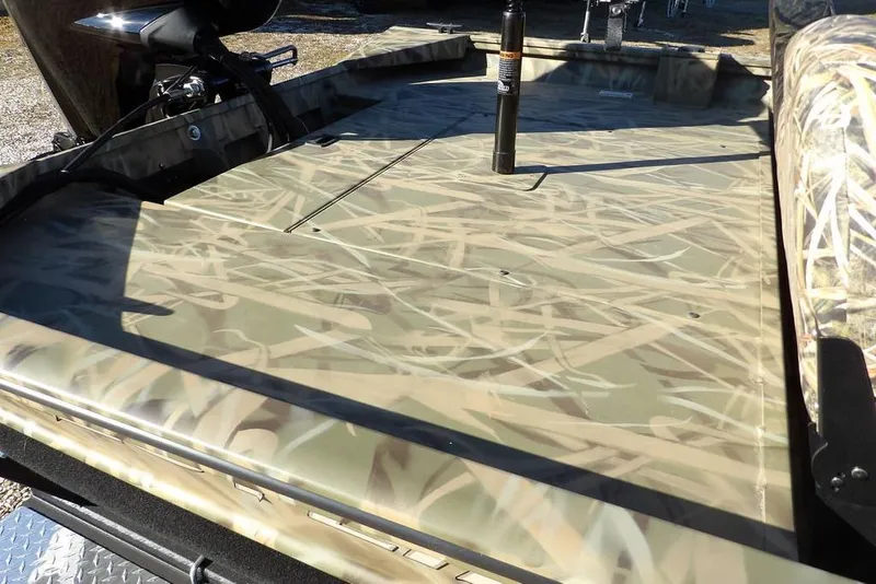 Slide: The Image of 2026 Crestliner 1860 Retriever SC boat with camouflage deck design. - 11