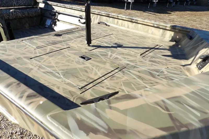 Slide: The Image of 2026 Crestliner 1860 Retriever SC boat with camouflage deck design. - 15