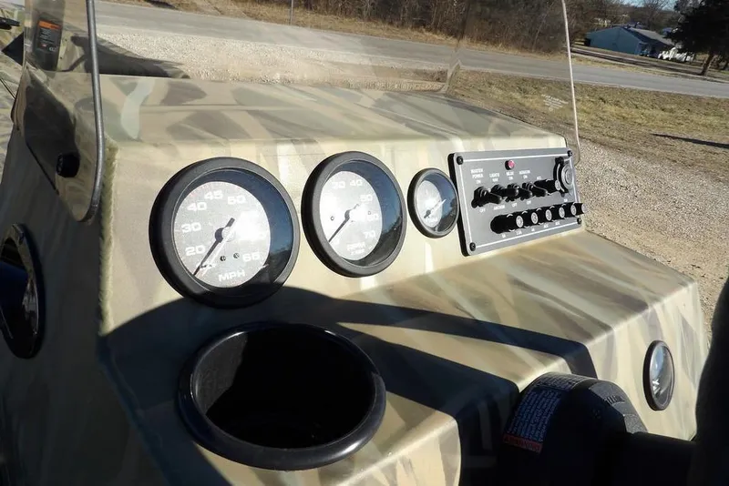 Slide: The Image of Dashboard of 2026 Crestliner 1860 Retriever SC boat with gauges and controls. - 19