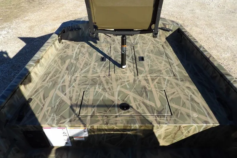 Slide: The Image of 2026 Crestliner 1860 Retriever SC boat with camouflage deck design. - 23