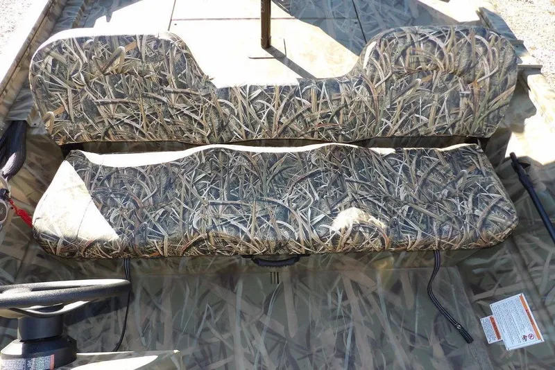 Slide: The Image of Camo-patterned seating in 2026 Crestliner 1860 Retriever SC boat interior. - 24