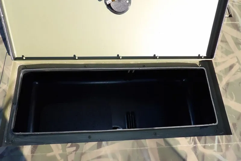 Slide: The Image of Open storage compartment of 2026 Crestliner 1860 Retriever SC boat. - 25