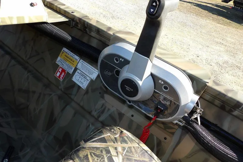 Slide: The Image of Control panel of 2026 Crestliner 1860 Retriever SC boat with throttle and safety features. - 27