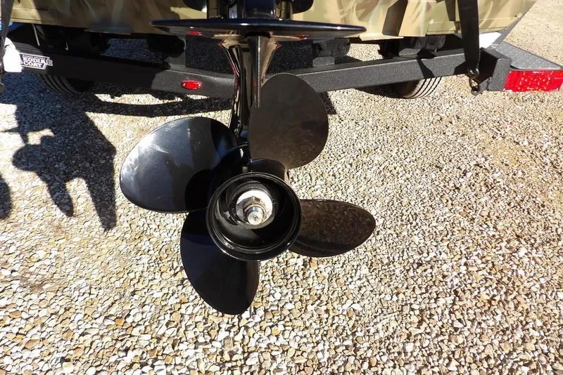 Slide: The Image of Propeller of 2026 Crestliner 1860 Retriever SC boat on gravel surface. - 28