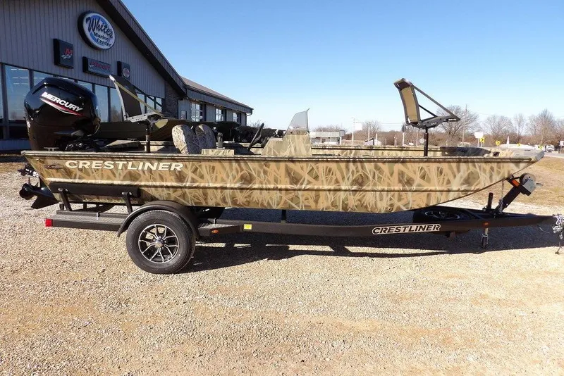 Slide: The Image of 2026 Crestliner 1860 Retriever SC boat with camouflage design on a trailer. - 3