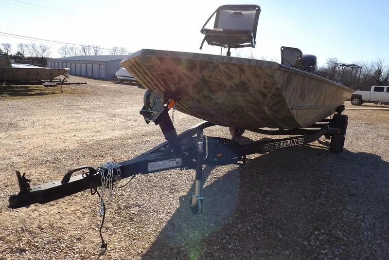 Slide: The Image of 2026 Crestliner 1860 Retriever SC boat on trailer in outdoor setting. - 33