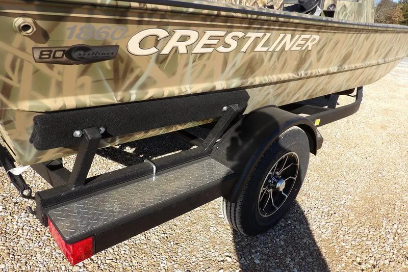Slide: The Image of 2026 Crestliner 1860 Retriever SC boat on trailer, featuring camouflage design and durable build. - 34