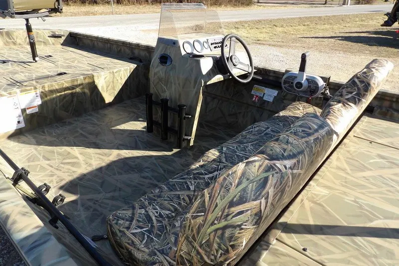 Slide: The Image of 2026 Crestliner 1860 Retriever SC boat with camouflage interior and steering console. - 9