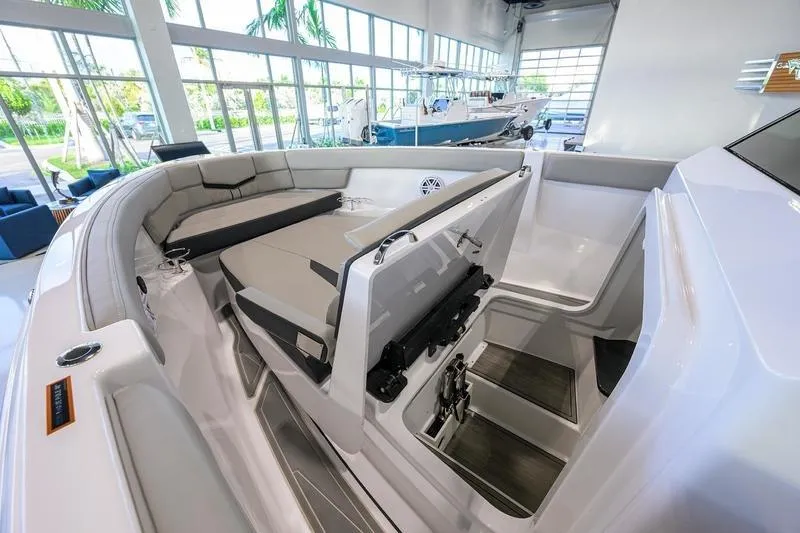 Slide: The Image of 2026 Monterey Elite 25 OB boat interior with spacious seating and modern design. - 4