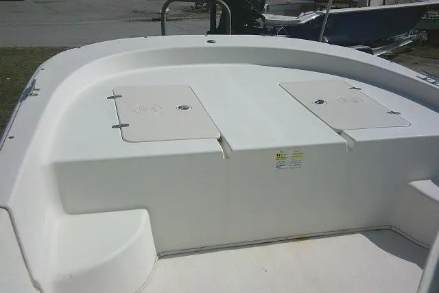 Slide: The Image of 2013 Carolina Skiff 218 DLV boat deck with storage compartments. - 10