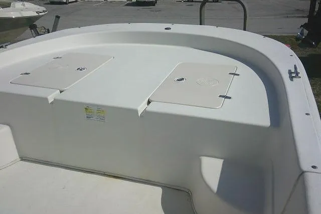 Slide: The Image of 2013 Carolina Skiff 218 DLV boat deck with storage compartments. - 11