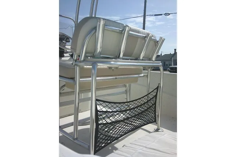 Slide: The Image of 2013 Carolina Skiff 218 DLV boat seat with metal frame and storage net. - 25