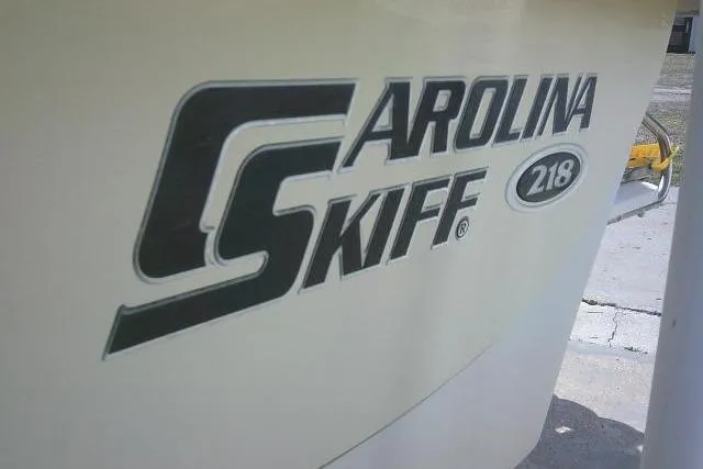 Slide: The Image of 2013 Carolina Skiff 218 DLV logo on boat exterior, close-up view. - 5