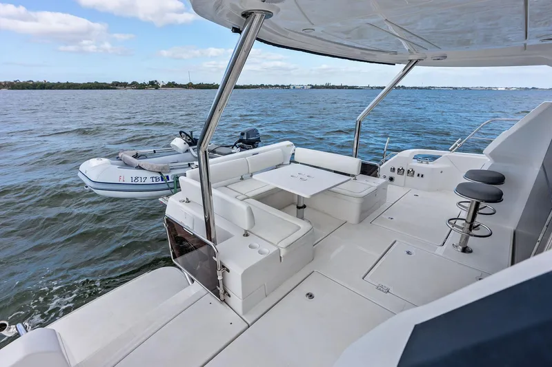 Slide: The Image of 2021 Aquila 44 Yacht deck with seating and ocean view. - 19