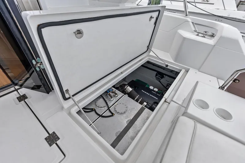 Slide: The Image of Open engine compartment of 2021 Aquila 44 Yacht, showcasing mechanical components. - 23