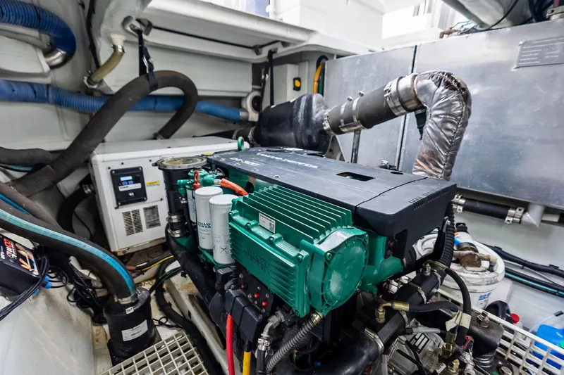 Slide: The Image of Engine room of 2021 Aquila 44 Yacht showcasing mechanical components and systems. - 25