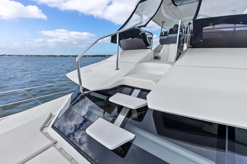 Slide: The Image of Aquila 44 Yacht 2021 on water, showcasing sleek design and modern features. - 27