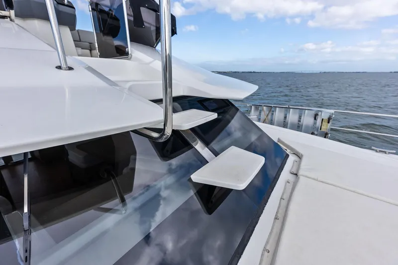 Slide: The Image of Aquila 44 Yacht 2021 on open water, showcasing sleek design and modern features. - 28
