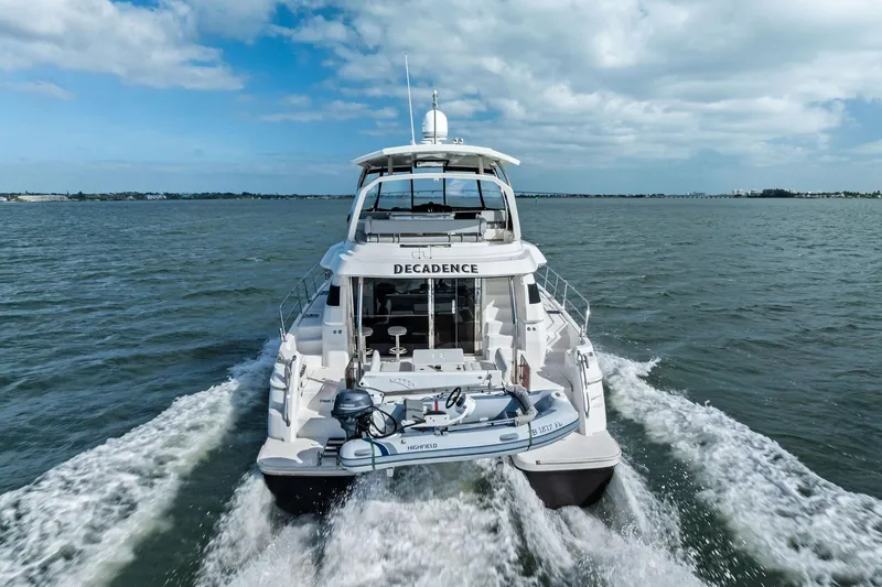 Slide: The Image of 2021 Aquila 44 Yacht cruising on open water under a partly cloudy sky. - 3