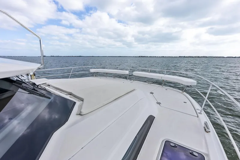 Slide: The Image of Aquila 44 Yacht 2021 on open water under cloudy sky. - 30