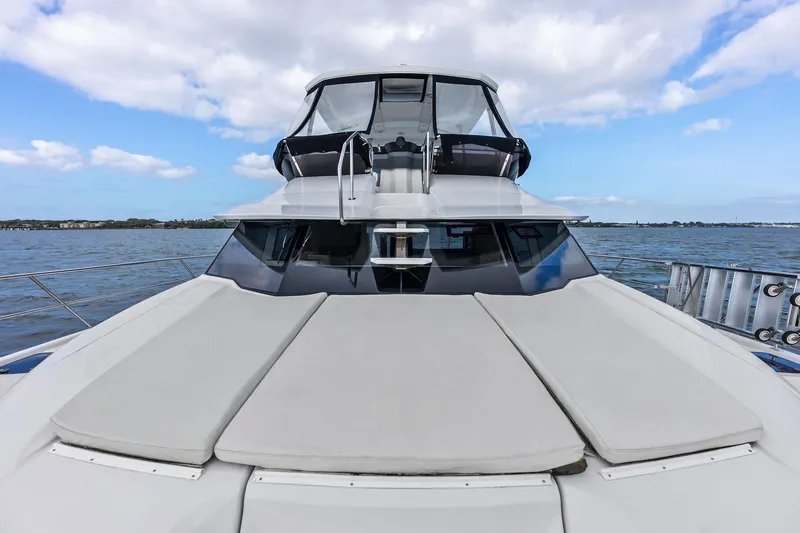 Slide: The Image of Aquila 44 Yacht 2021 on serene water, showcasing spacious deck and sleek design. - 31