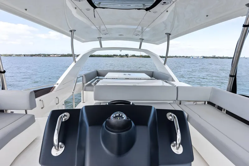 Slide: The Image of Luxurious 2021 Aquila 44 Yacht interior with sleek seating and panoramic water views. - 34