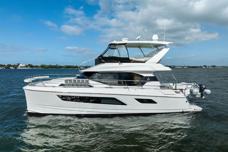 Slide: The Image of 2021 Aquila 44 Yacht cruising on a sunny day with blue skies. - 4