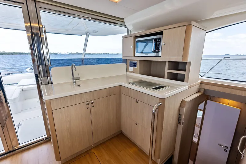 Slide: The Image of Modern kitchen interior on 2021 Aquila 44 Yacht with ocean view. - 44