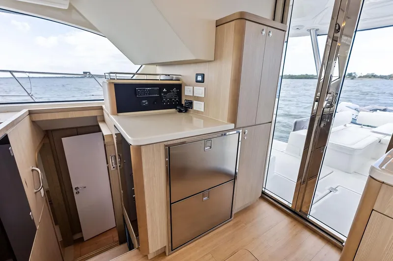 Slide: The Image of Interior of 2021 Aquila 44 Yacht with modern kitchen and ocean view. - 47
