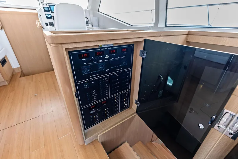 Slide: The Image of Electrical panel on 2021 Aquila 44 Yacht with wooden interior and control displays. - 51