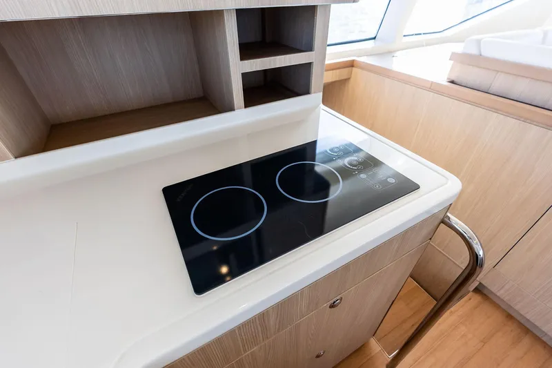 Slide: The Image of Modern kitchen area on 2021 Aquila 44 Yacht with sleek induction cooktop. - 52