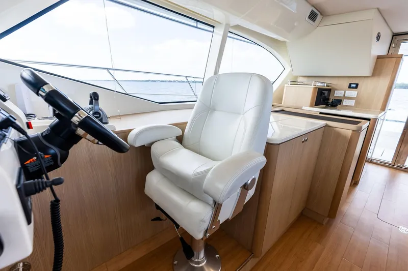 Slide: The Image of Interior of 2021 Aquila 44 Yacht with helm station and luxurious seating. - 56