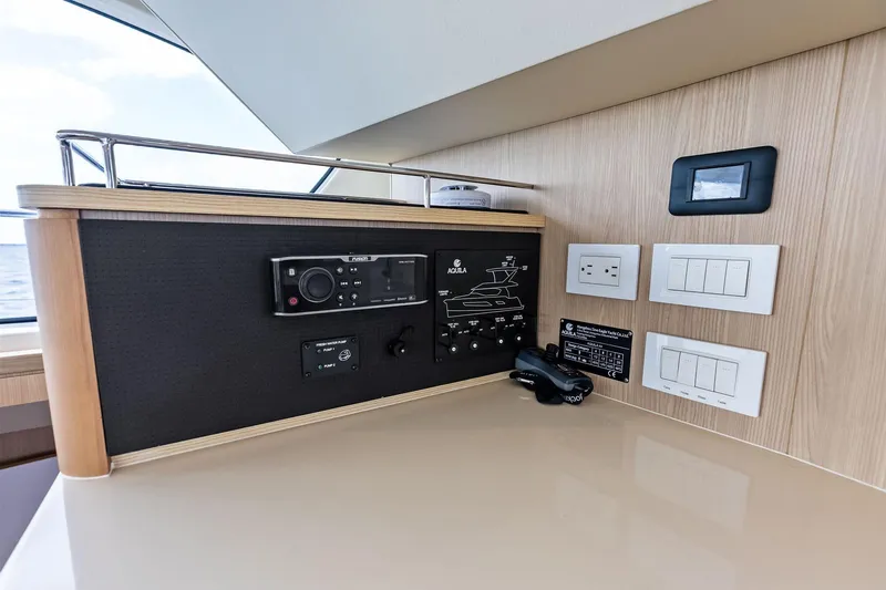Slide: The Image of Control panel of 2021 Aquila 44 Yacht with switches and outlets. - 57
