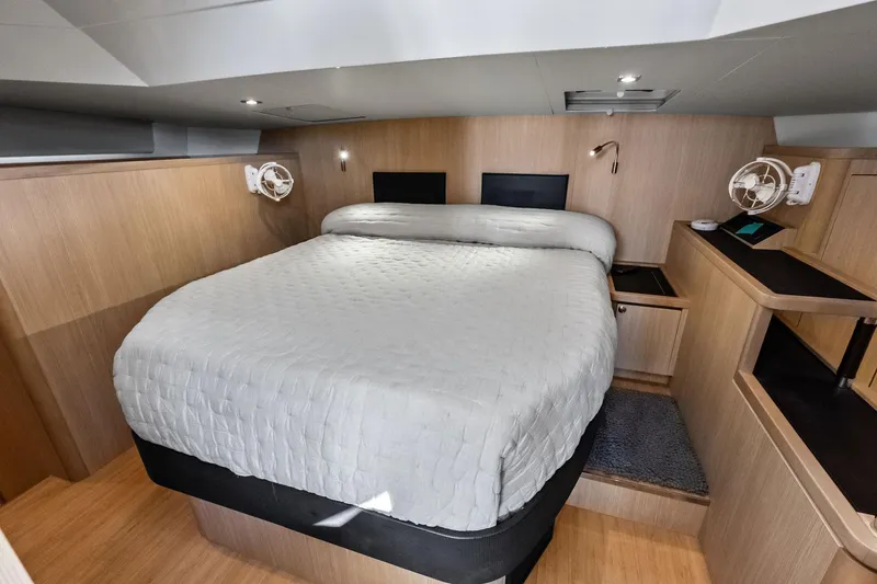 Slide: The Image of Luxurious bedroom interior of 2021 Aquila 44 Yacht with modern design and cozy bedding. - 63