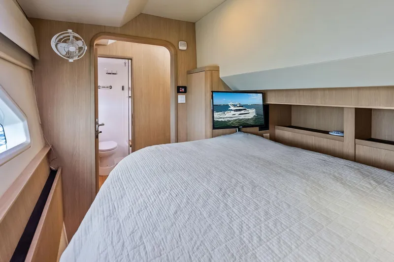Slide: The Image of Luxurious bedroom interior of 2021 Aquila 44 Yacht with TV and ensuite bathroom. - 66
