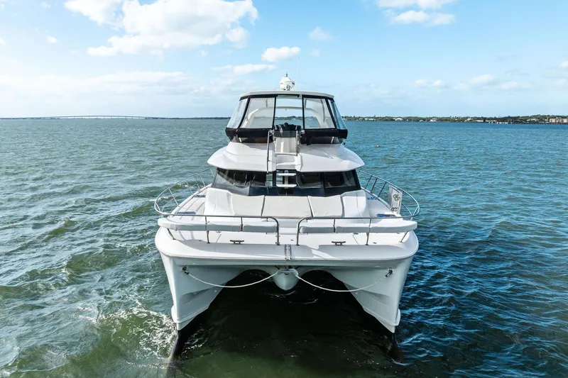 Slide: The Image of Front view of 2021 Aquila 44 Yacht on open water under blue sky. - 7