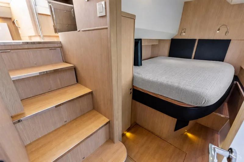 Slide: The Image of Interior of 2021 Aquila 44 Yacht featuring wooden stairs and cozy sleeping area. - 71