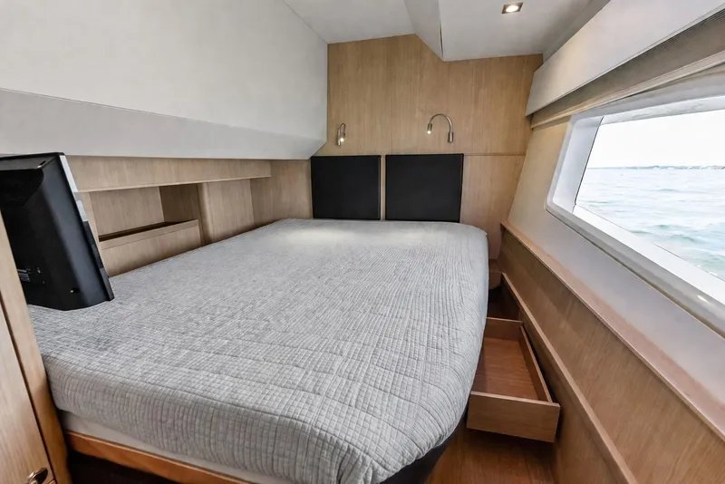 Slide: The Image of Interior cabin of 2021 Aquila 44 Yacht with bed and ocean view. - 72