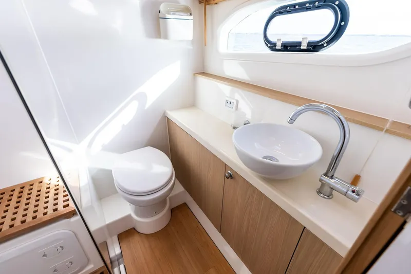 Slide: The Image of Luxurious bathroom interior of 2021 Aquila 44 Yacht with modern fixtures and ocean view. - 74