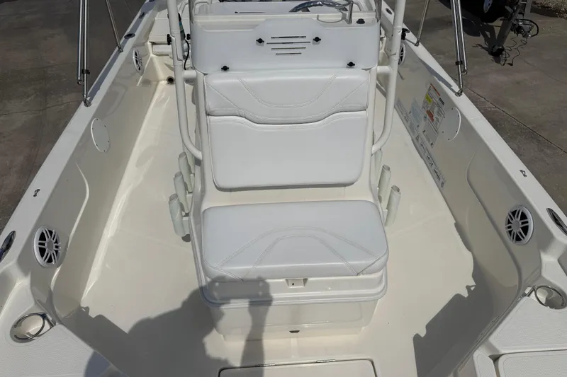 Slide: The Image of 2024 Skeeter SX210 boat interior with white seating and modern design. - 11