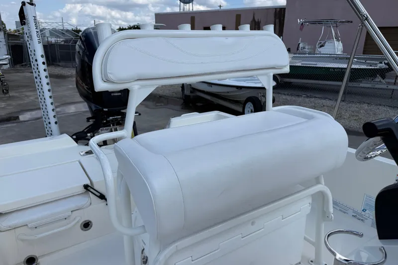 Slide: The Image of 2024 Skeeter SX210 boat interior with white seating and Yamaha engine. - 6