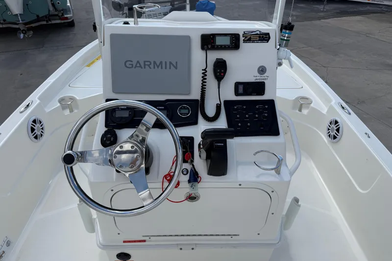 Slide: The Image of 2024 Skeeter SX210 boat console with Garmin navigation and control panel. - 9