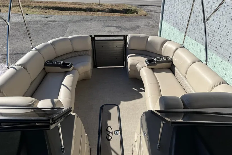 Slide: The Image of 2019 Harris Solstice DC 230 pontoon boat with beige seating and cup holders. - 10